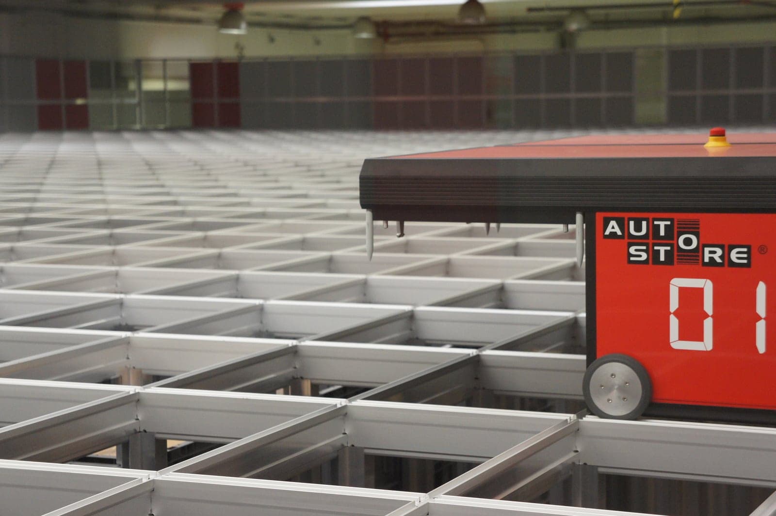 An AutoStore robot on the top of an AutoStore grid.