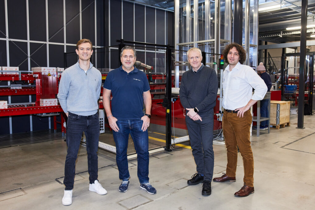 Picture of CEO from AutoStore, CEO from Apotea, Co-founder of Element Logic and Co-founder of RightHand Robotics standing in front of the Apotea AutoStore solution.