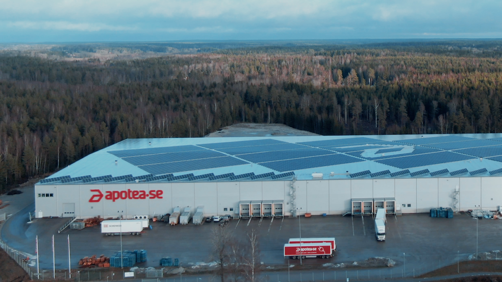 A drone photo of the Apotea site with woods in the background