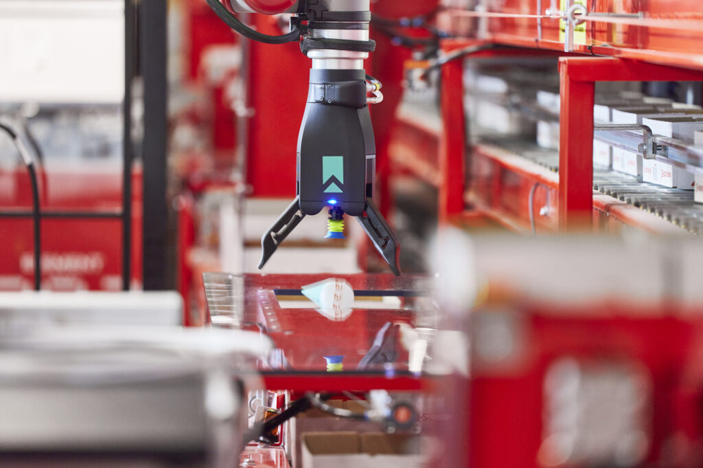 eOperator, a warehouse automation robotic arm picks orders.