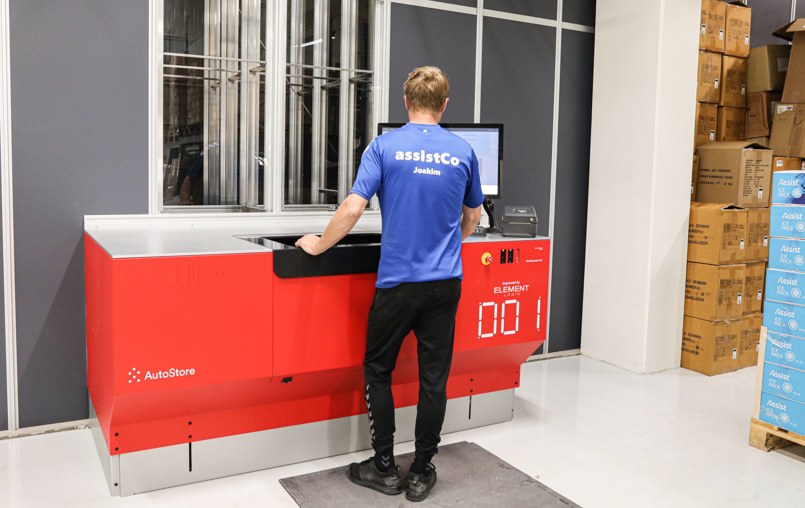 A man is picking items in the warehouse of AssistCo.