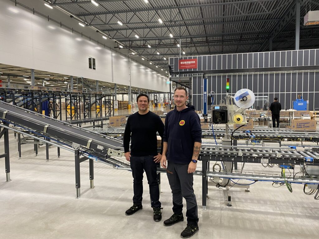 The Matsmart team standing in their AutoStore warehouse from Element Logic.