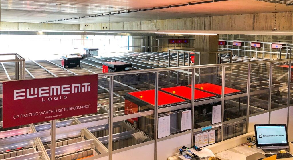 A view over the AutoStore grid at eXXpozed from the service mezzanine.