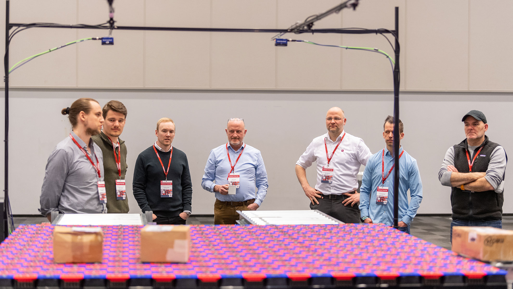 Seven people looking at an automated warehouse solution