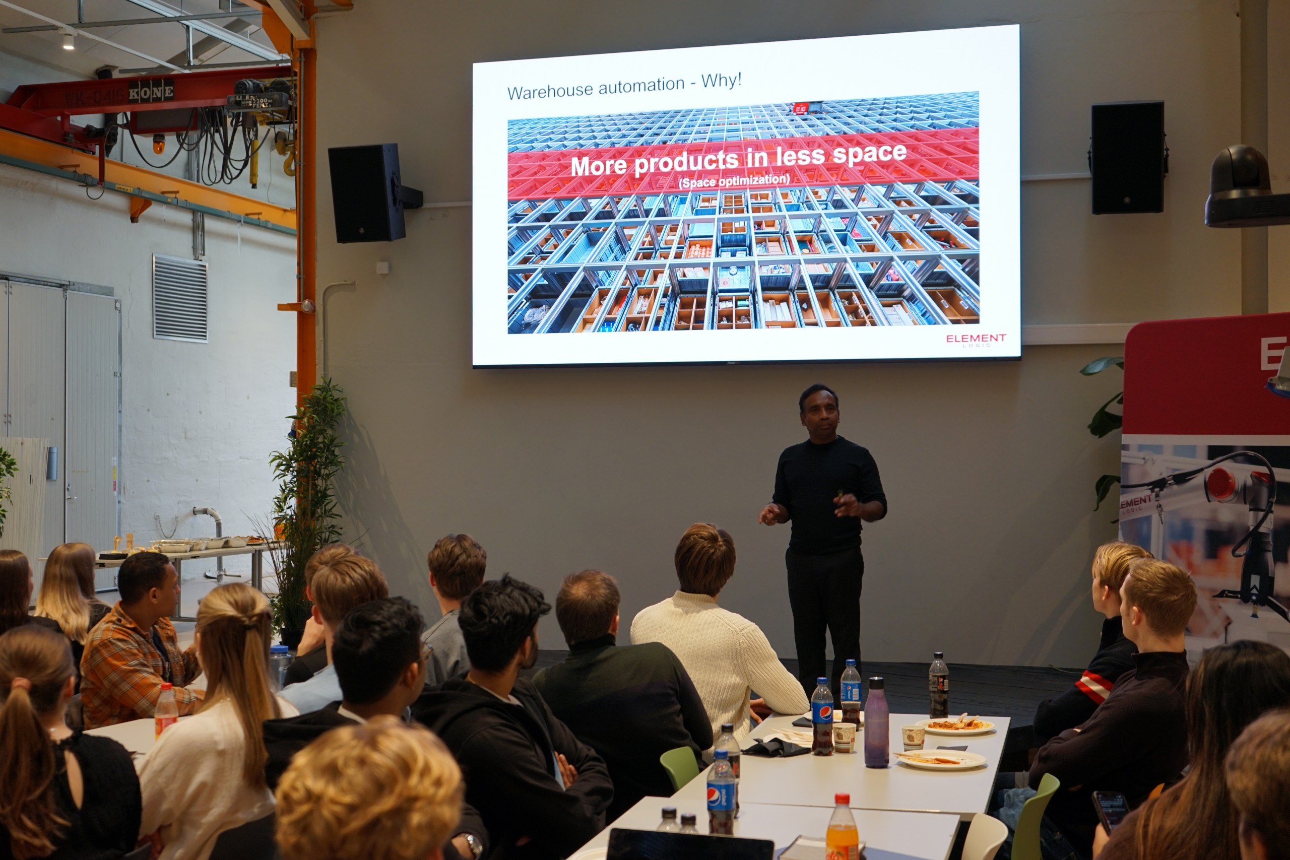 Man holding a presentation in front of students