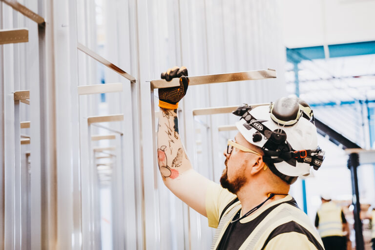 man working on installing a grid