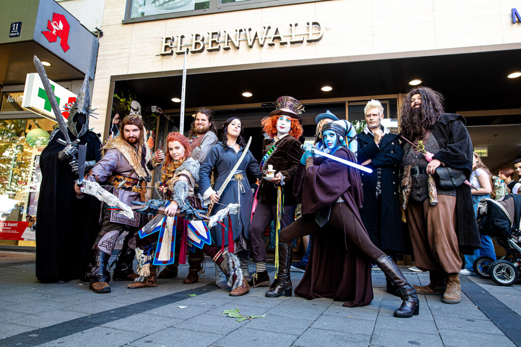 Elbenwald customers dressed in costumes standing outside of the store posing as different characters.