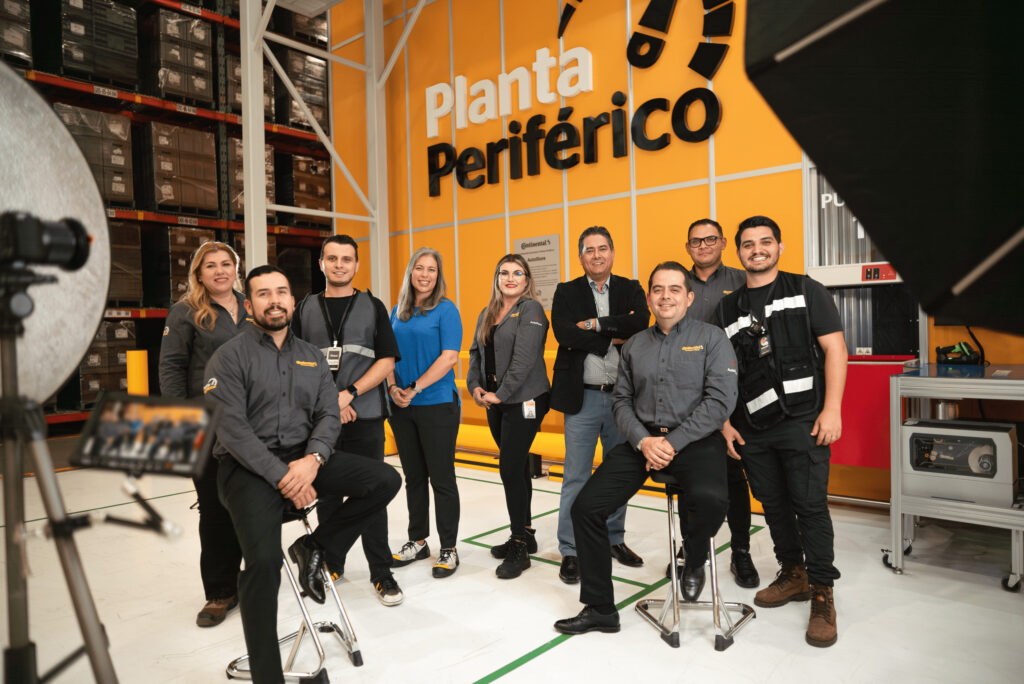 A picture Continental and Element Logic employees in front of the AutoStore system at the Continental plant