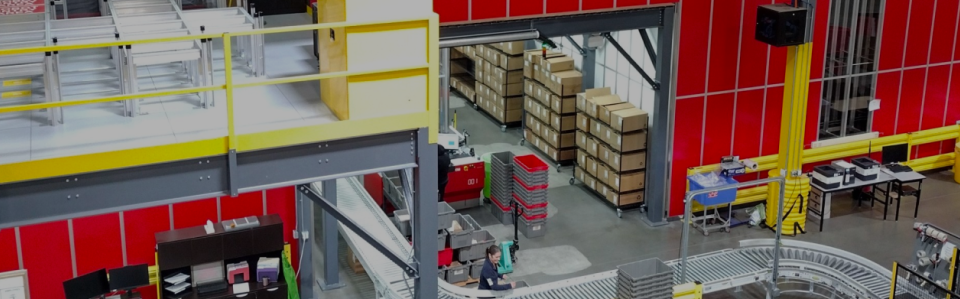 An illustration of the Helly Hansen warehouse with view of the mezzanine and conveyor belt in the background