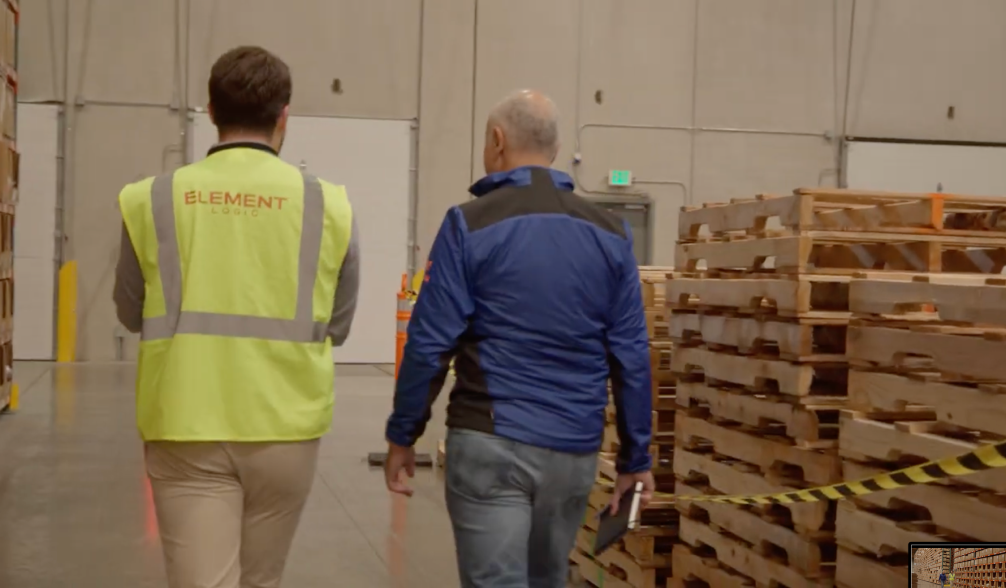 Two people walking around in the Helly Hansen warehouse