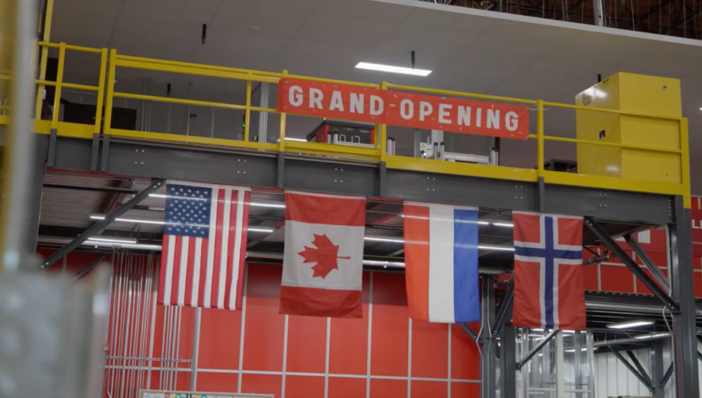 The American, Canadian, French and Norwegian flag decorating the mezzanine at the grand opening of the Helly Hansen warehouse