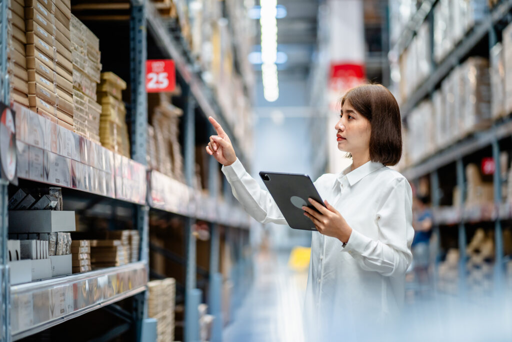 woman holds a tablet and checks inventory