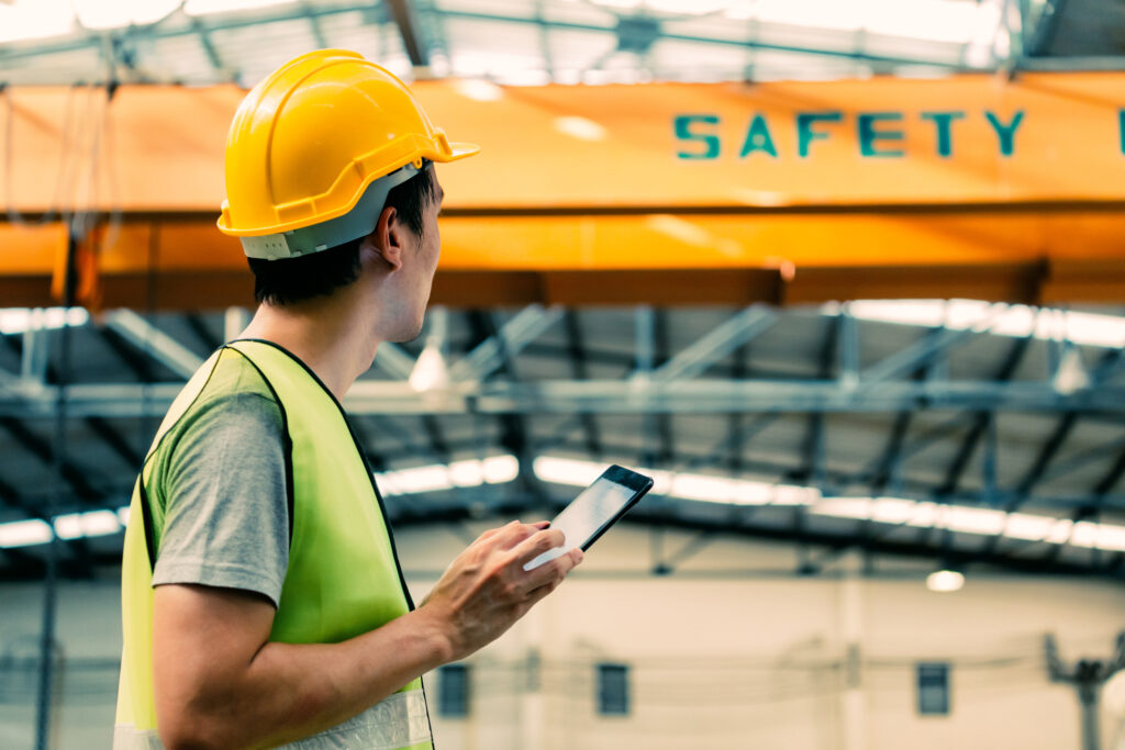 man in yellow jacket with hardhat safety inspector